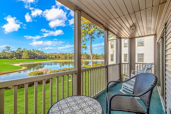 Enjoy refreshments from your porch overlooking the 4th hole of True Blue Golf 