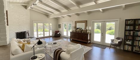 Living Room with wood burning adobe fireplace