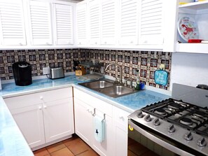 also includes dinnerware, silverware, pots and pans, rice cooker, and crock pot