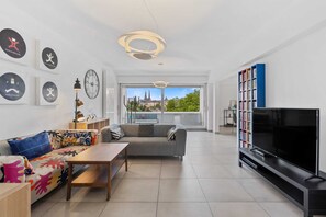 Cozy up in our vibrant living space, ideal for relaxation and entertainment.