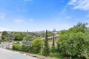 Wake up to breathtaking views of the city's historic skyline – perfect for your morning coffee.
