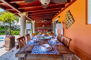 Outdoor dining table for enjoying meals by the pool
