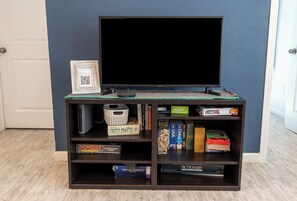 TV with Roku and Xfinity Flex. Lots of board games  