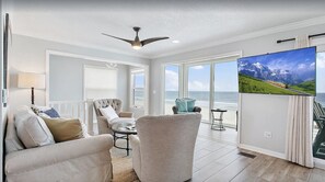 Family room with large screen tv and incredible views of the ocean