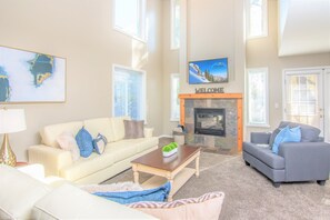 Gorgeous open concept great room with fireplace and sofas