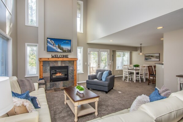 Spacious modern great room with nice seating and fireplace