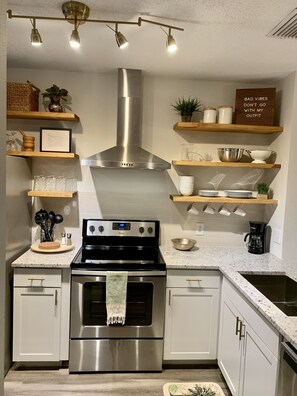 Newly renovated kitchen. Stainless steel, granite counters, new cabinets/floors
