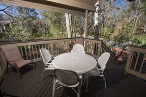 Back porch with seating perfect for relaxing
