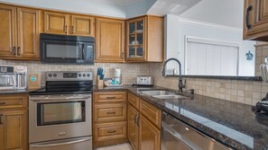 Open concept kitchen with stainless steel appliances