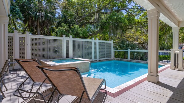 Outdoor pool with hot tub and lounge area