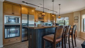 Spacious kitchen bar top with additional seating