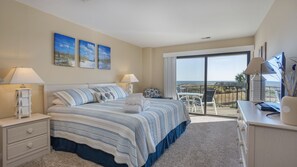 Primary bedroom featuring a king-size bed