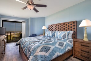 Primary bedroom featuring a king-size bed