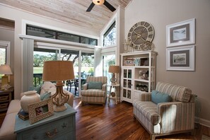 Spacious living room with cozy furnishing and tasteful decor