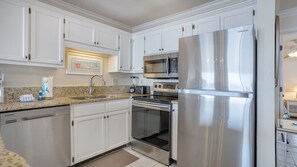 Open kitchen with stainless steel appliances