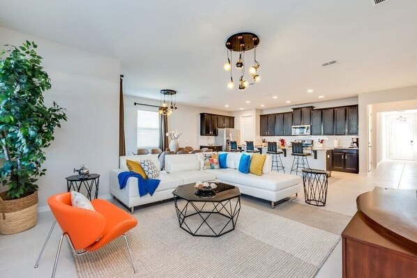 Beautiful living room with ample seating and flat screen TV