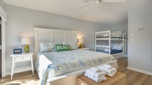 Second floor bedroom with king bed and bunk bed