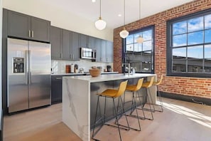 Kitchen bar has seating for 4