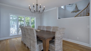 Bright dining area with large windows offering natural light and views of the surrounding area.