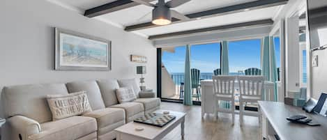 Open Plan Living Area. Comfortable Sofa with two Built-In Recliners with Sweeping Floor to Ceiling Views of the Gulf of Mexico. Large Flat Screen TV w/Built-In DVD Player and Stereo