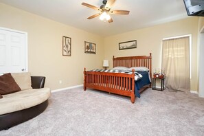 Master bedroom features a king bed and 32" smart TV