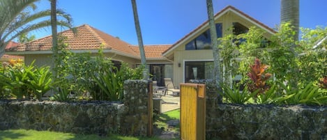 The backyard gate opens to a green belt for a short walk to beautiful beaches.