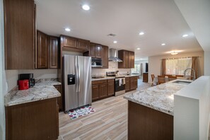 Large Kitchen for lots of cooking and gathering around. 