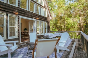 Ample seating on the deck to enjoy the private yard