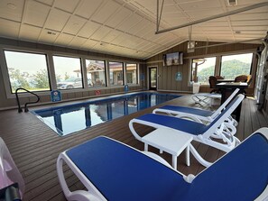 Large windows all around the pool house allows plenty of sunshine and views