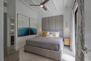 Bedroom 1 (Main floor): King bed, full ensuite, TV, A/C, fan, walkout to yard