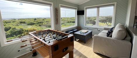 Game room and sunroom with views of the sound.