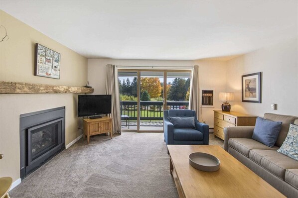 Well-appointed living room with deck access