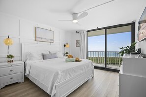 Soothing primary suite with comfy king bed and balcony with Gulf views