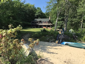 Large yard leading from house to the beach