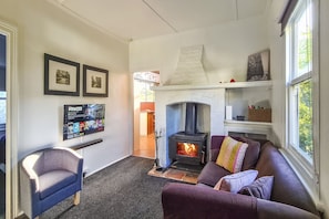 Lounge with smart TV and woodburner
