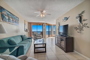 Living Room with a Queen Size Sleeper Sofa, Flat Screen TV and Floor to Ceiling Views of the Gulf of Mexico