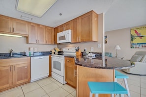 Fully Equipped Kitchen with Extra Seating at the Breakfast Bar