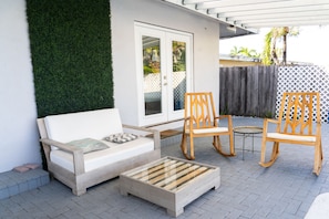 Lodge out in the shade under the pool side pergola