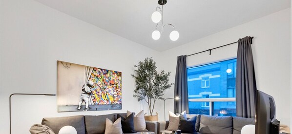 Living Room: Features 2 sofa beds and a Smart HD TV. Log in to your favorite streaming services like Netflix, Disney+, and Prime.