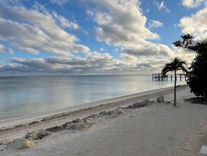 Southwest view of beach from patio during the day.