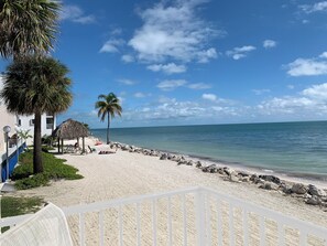 Southeast view of beach off of patio.  Take long walks on beautiful sandy beach.