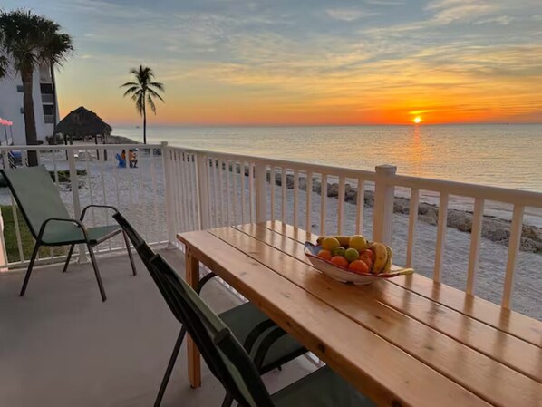 Watch the sunrise on your private patio directly on the beach.