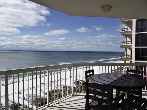 Balcony with table and 4 chairs for eating outside
