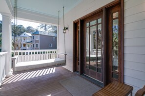 Nice front porch for relaxing. There is swing bed for your enjoyment.