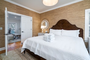 The first floor primary bedroom has a king bed and private bath