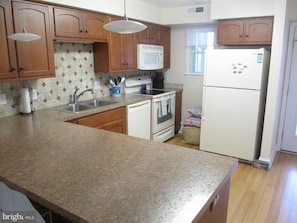 Updated Full Kitchen with plenty of counter space.