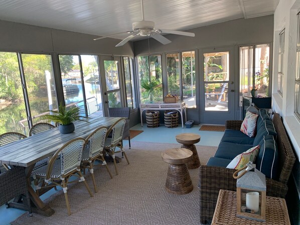 Glass and screened porch with a/c on the water