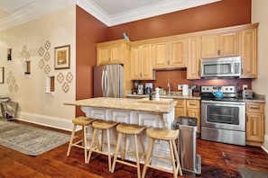 Professionally Equipped Chef's Kitchen with Breakfast Bar Seating
