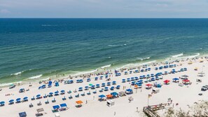 View from balcony of white sandy beaches and crystal blue water.