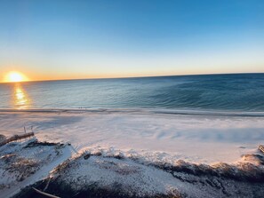 Gorgeous sunrise peaking through picture taken from balcony